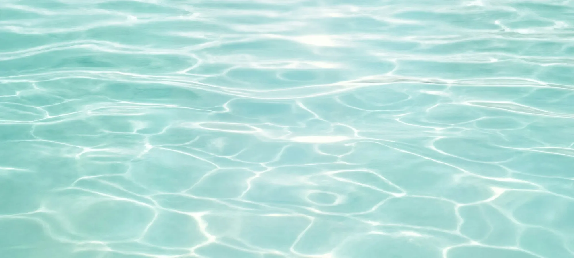Clear, sunlit pool water